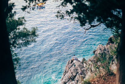 High angle view of rocks by sea