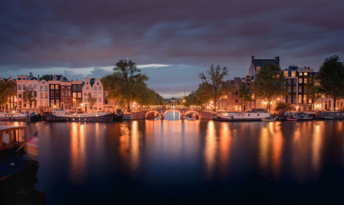 Illuminated buildings in water