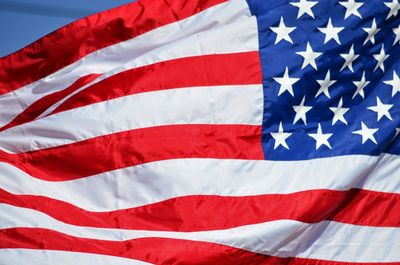 Close-up of flag against blue sky