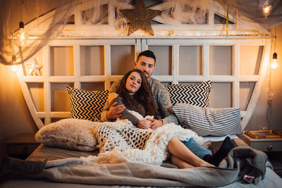 Young couple relaxing at home