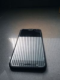 High angle view of smart phone on table