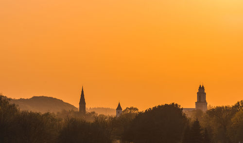 Buildings against sky during sunset