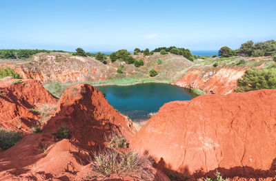 High angle view of lake amidst rock mountains