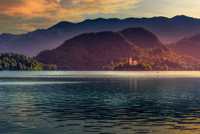 Scenic view of lake against sky during sunset