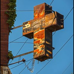 Low angle view of built structure against clear blue sky