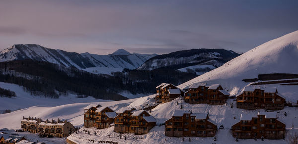 Scenic view of snow covered mountains against sky