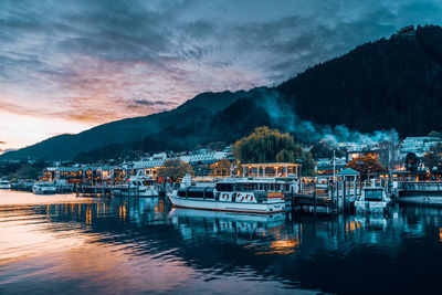 Scenic view of river against sky at sunset