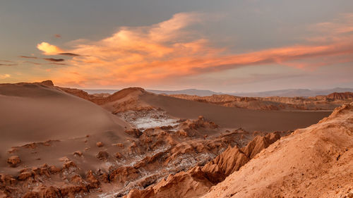 Scenic view of desert against sky during sunset