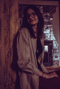 Portrait of smiling young woman standing outdoors