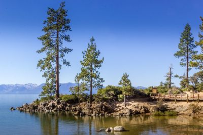 Scenic view of mountains against clear blue sky