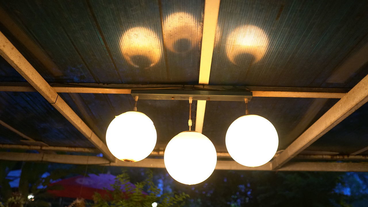 LOW ANGLE VIEW OF ILLUMINATED PENDANT LIGHT