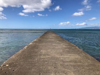 Pier over sea against sky