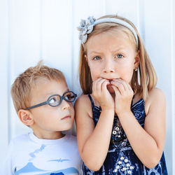 Close-up portrait of cute girl at home
