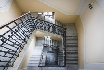 Low angle view of spiral staircase in building