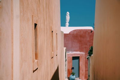 Buildings in city during sunny day