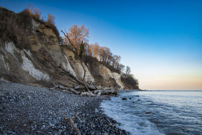 Scenic view of sea against clear blue sky