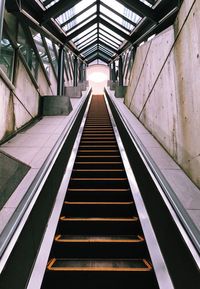 Upward view of empty escalator. going on and on.