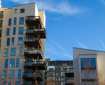 Low angle view of buildings against blue sky