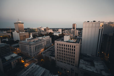 High angle view of illuminated buildings in city against sky