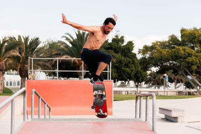 Skateboarder doing a trick in a skate park