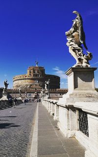 Statue of historic building against blue sky