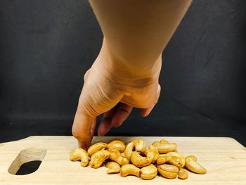 Close-up of person preparing food on table