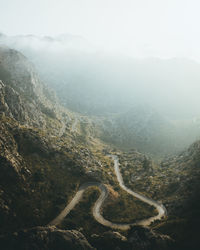 Scenic view of mountains in foggy weather