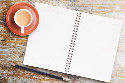 High angle view of coffee cup on table