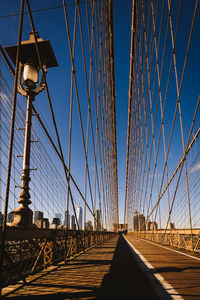 Suspension bridge against clear blue sky