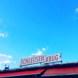 Low angle view of building against blue sky