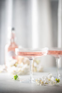 Close-up of white wine glass on table