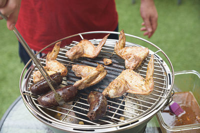 High angle view of meat on barbecue grill