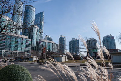 Modern buildings in city against sky