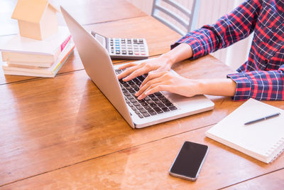 High angle view of man using laptop on table