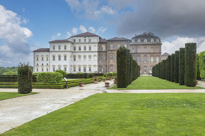 The beautiful facade and gardens of the reggia dei savoia in the venaria reale