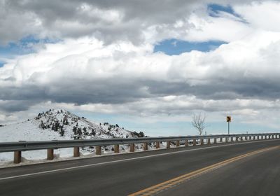 Road by sea against sky