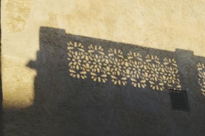 Shadow of sunlight on ground