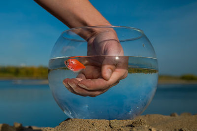 Cropped hand of woman holding crystal ball