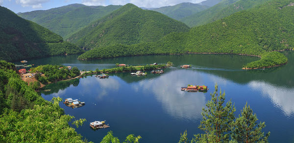 High angle view of ducks on lake against mountains