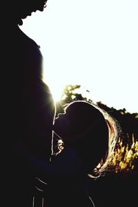 Close-up of silhouette man against clear sky