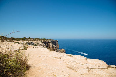 Scenic view of calm sea against clear sky