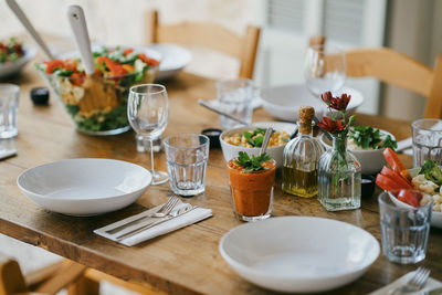 Dining table with dinner at patio in backyard