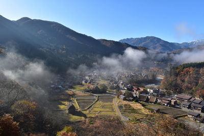 Scenic view of landscape and mountains against sky