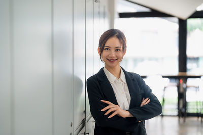 Portrait of businessman standing in city