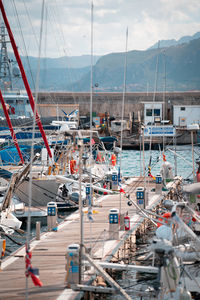 Boats moored at harbor