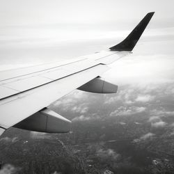 Cropped image of airplane wing