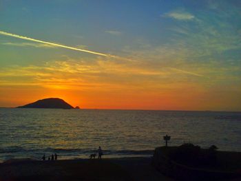 Scenic view of sea at sunset