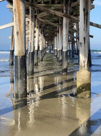 Pier over sea against sky