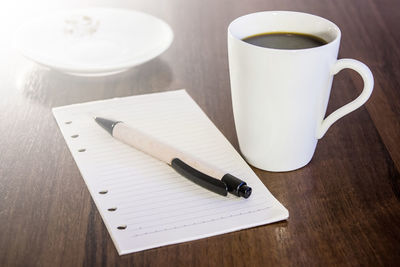 Close-up of coffee cup on table