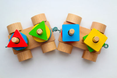 High angle view of toys on table against white background